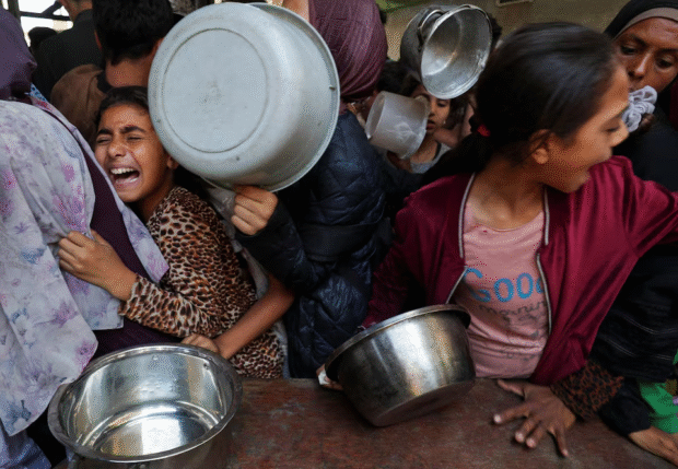 ‘Our children are dying slowly’ says father searching for food in Gaza